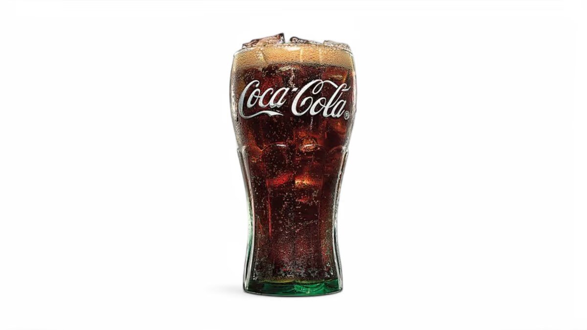 Coca-Cola Zero in a branded glass with ice