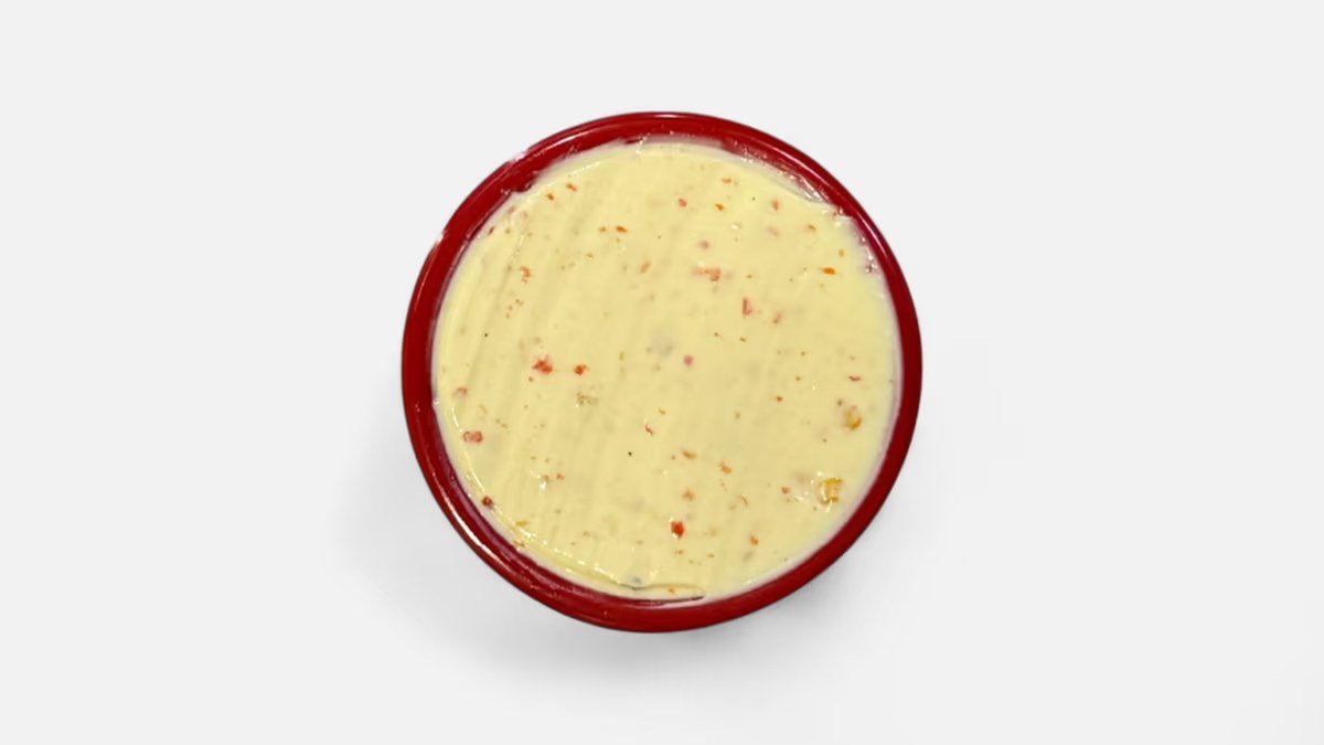 Spicy mayo in a red ramekin